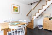 The turning staircase leads from the sitting/dining-room.