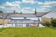 The gorgeous terrace has two sitting areas and leads onto the grassed lawn where the children and family dog can let off steam.