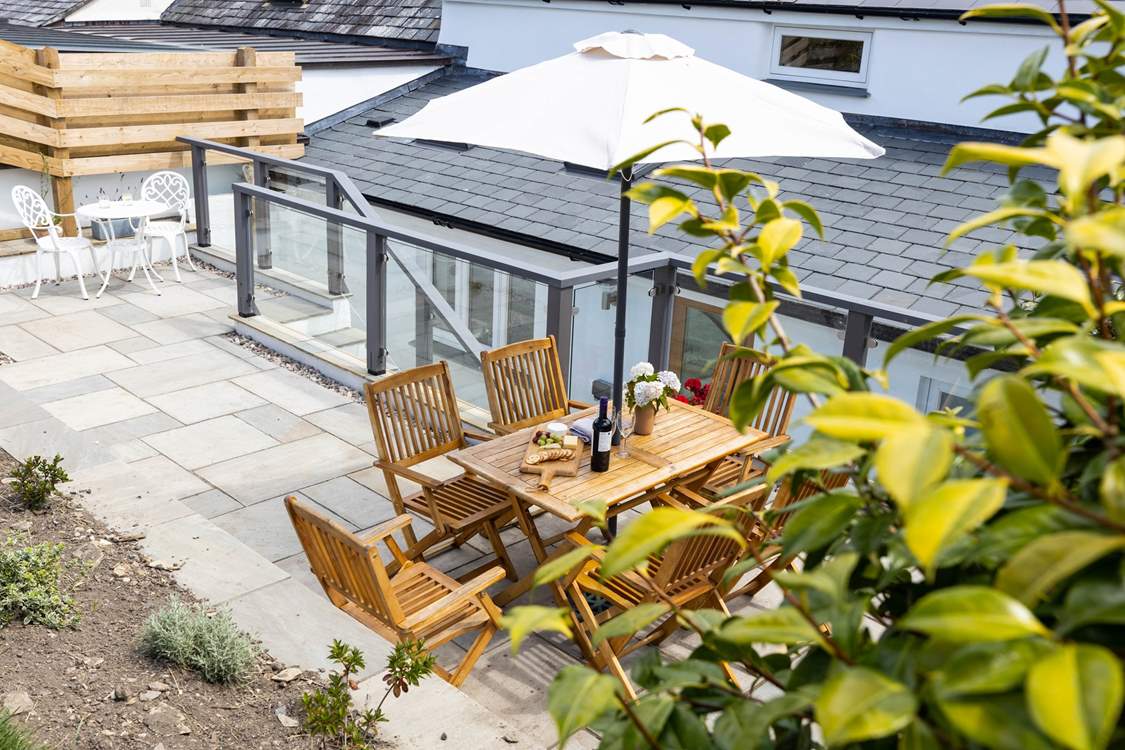 Take a flight of steps from the kitchen at the rear and a fabulous patio awaits