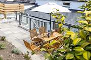Take a flight of steps from the kitchen at the rear and a fabulous patio awaits
