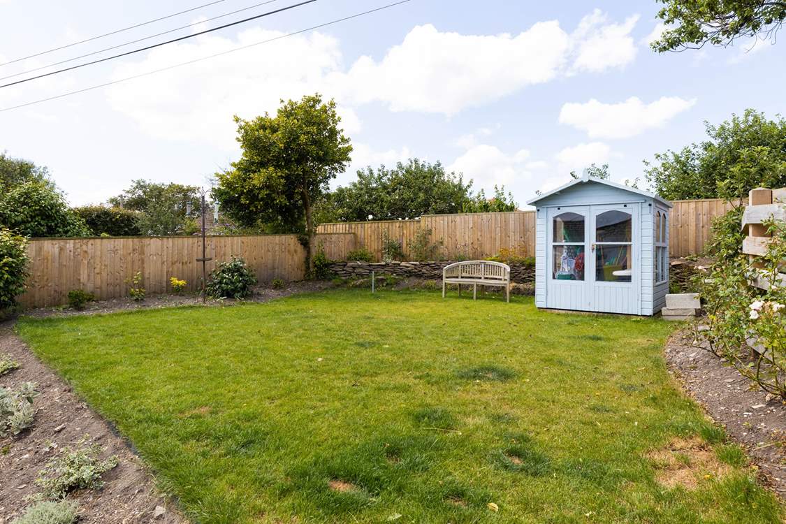 The lawn area above the patio.