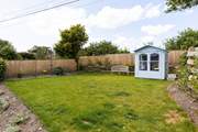 The lawn area above the patio.