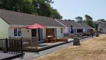 Sugar Beach sits in a row of holiday abodes around a grassed area.