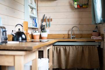 Rustle up a delicious meal in the quaint kitchen.