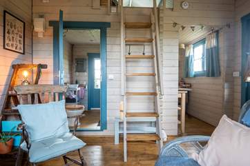 Walk up the wooden steps to find the tucked away sleeping area.