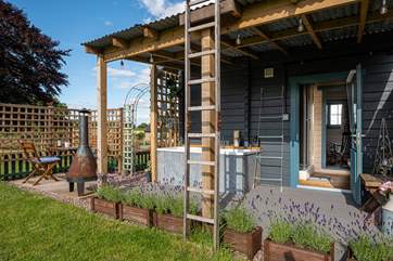 The outdoor space is simply idyllic. Cook up a romantic meal for two in the rustic chiminea-style barbecue.