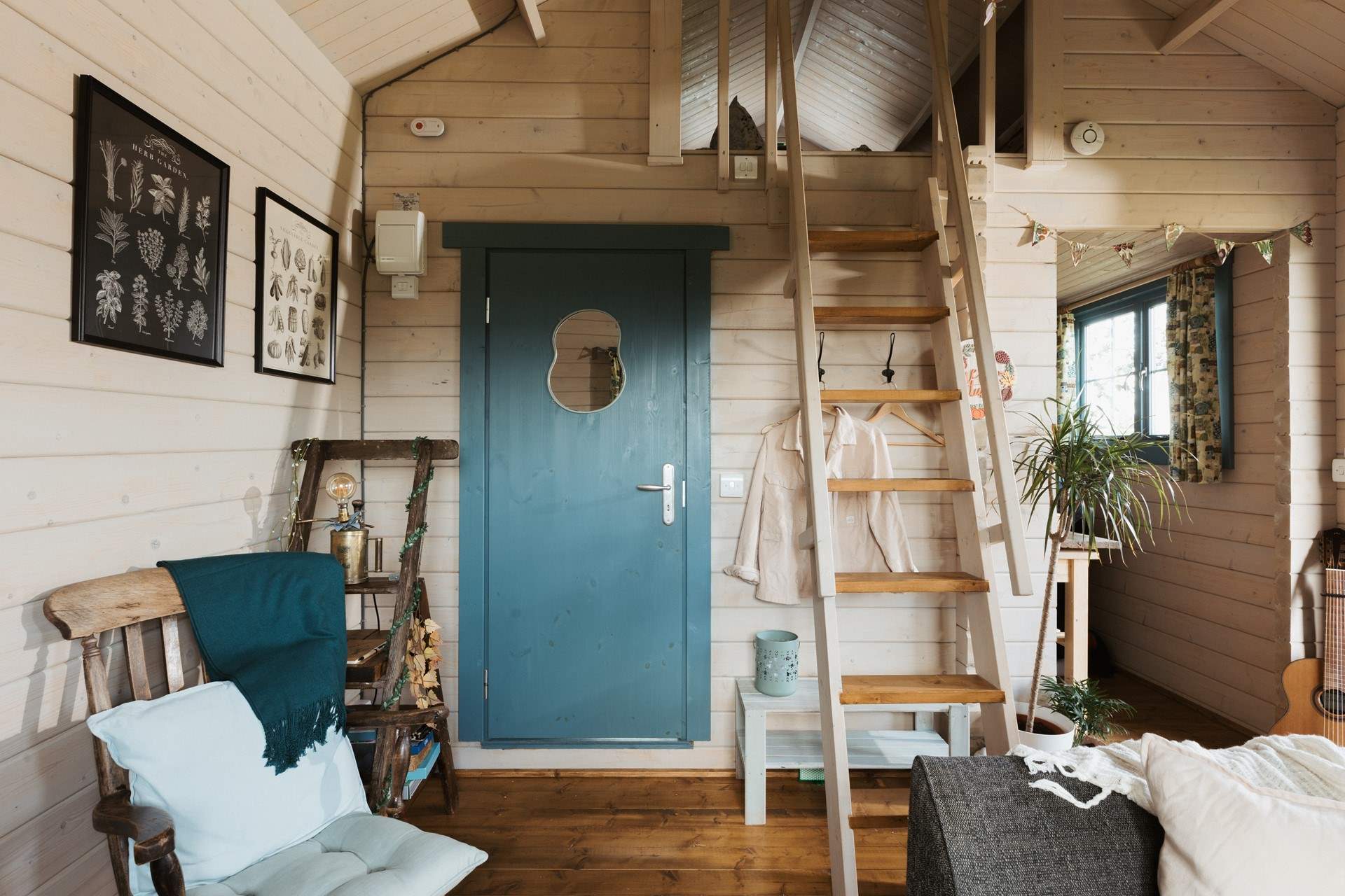 Climb the stairs to find the tucked-away sleeping area.