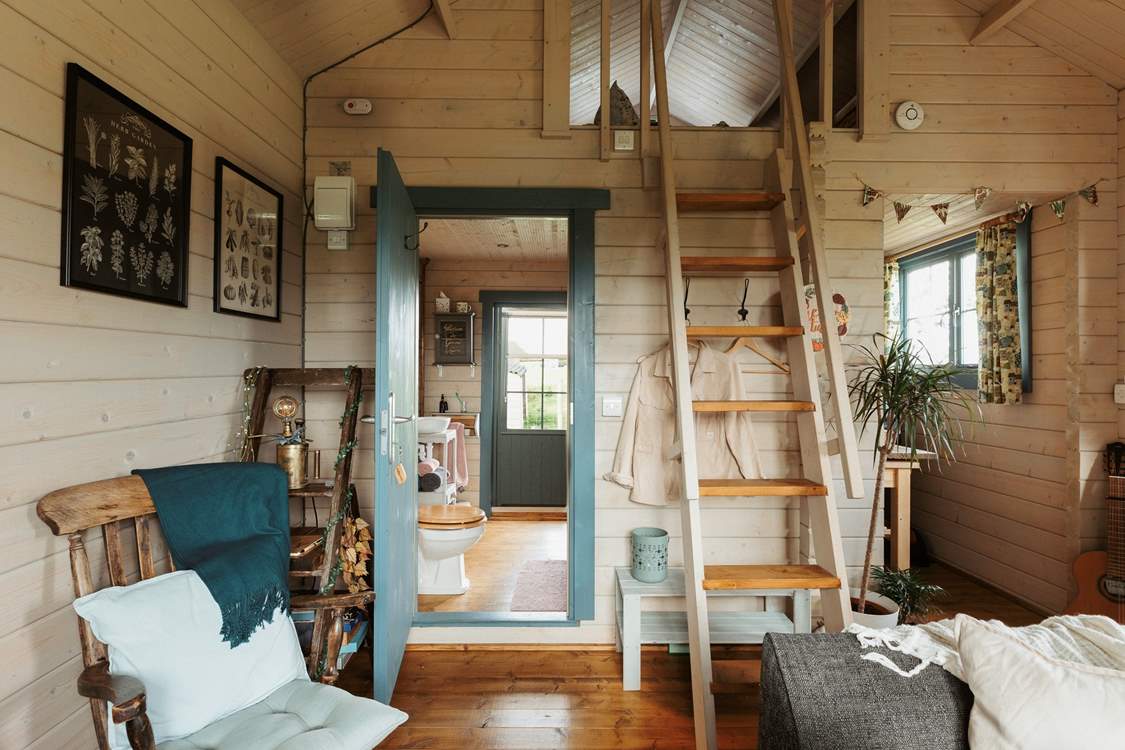 Climb the stairs to find the tucked-away sleeping area.