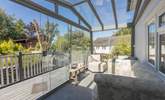 Relax in the fantastic conservatory and gaze out towards the lush garden. - Thumbnail Image