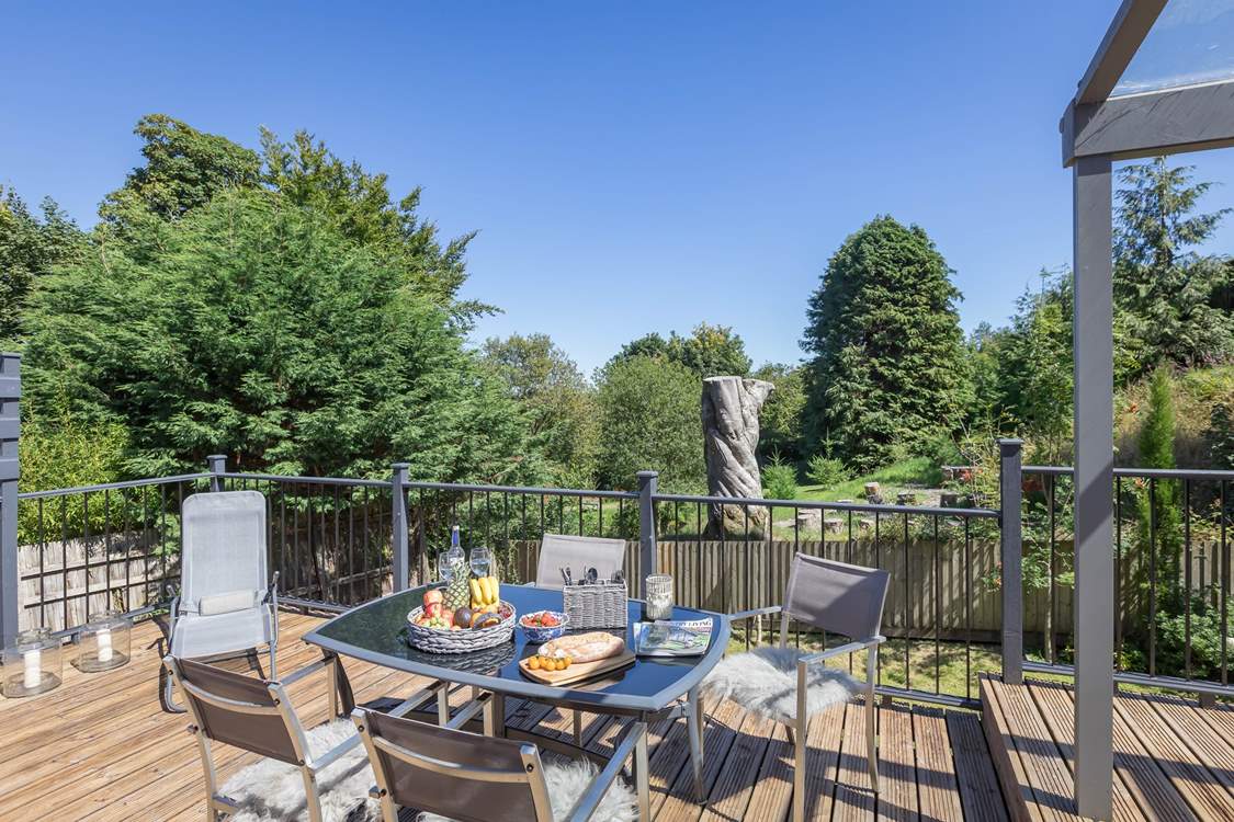 The raised deck area and outdoor furniture make al fresco dining a dream.