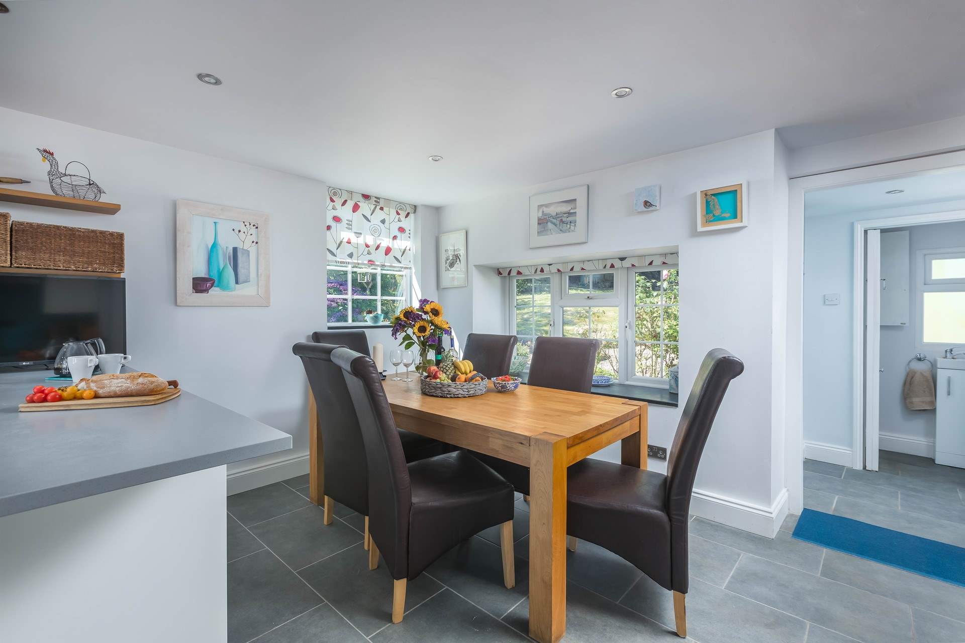 The wooden dining-table is superb for hearty family meals throughout the day.