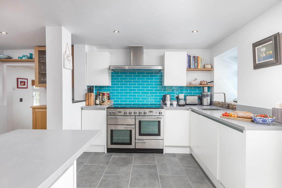 The modern kitchen has everything you'll need on your stay.