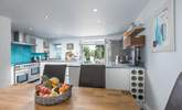 The light and airy kitchen/diner with doors out onto the raised decking area, to the back of the house. - Thumbnail Image