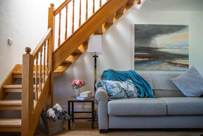 Venture up the open tread wooden staircase to discover the two inviting bedrooms.