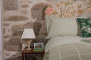 Pretty linens and a comfy bed await.