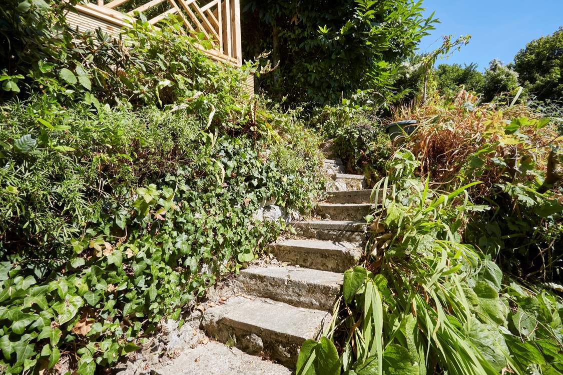 The steps located behind the property from the ground floor level lead to the upper decked area. Please take care as the steps are uneven and there are no hand rails.