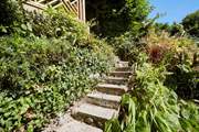 The steps located behind the property from the ground floor level lead to the upper decked area. Please take care as the steps are uneven and there are no hand rails.