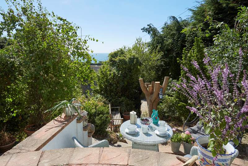 The secluded tiered garden is the perfect place to sit in the island sunshine.