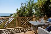 Sit on the upper deck located above the house and enjoy island living at its best.