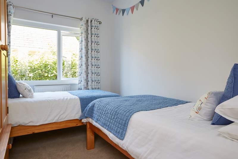 The pretty twin bedded room has two three-foot beds.