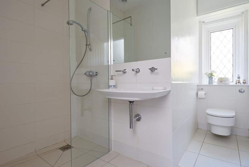 The shower-room on the ground floor is shared by the twin bedrooms 2 and main bedroom 3.