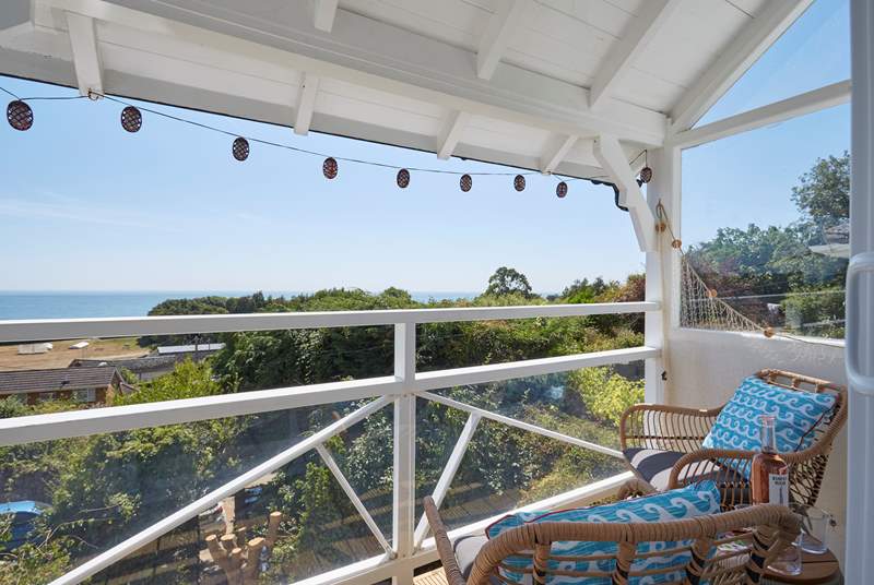 Sit a while and take in the stunning view from the balcony off the sitting area.