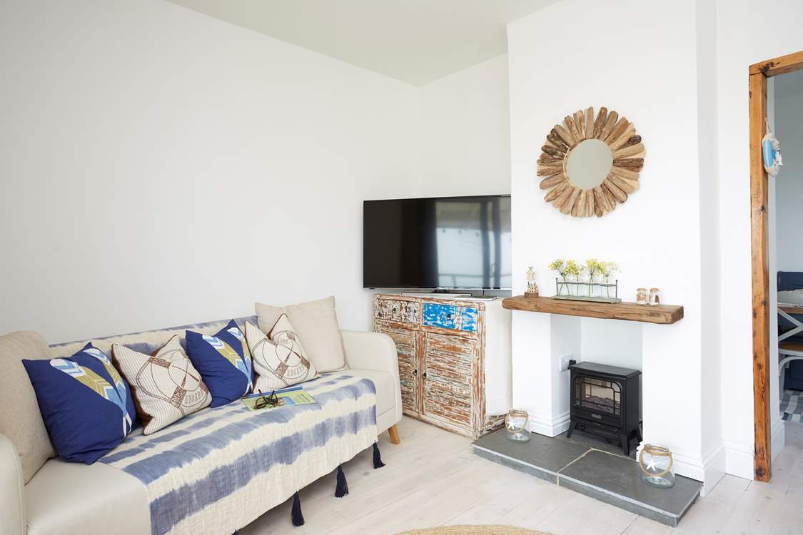 Relax on the sofa after a busy beach day and catch up with a movie on the Smart TV.