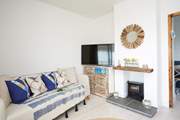 Relax on the sofa after a busy beach day and catch up with a movie on the Smart TV.