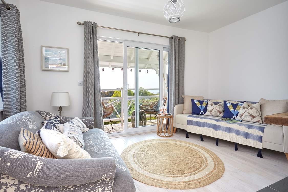 With a fabulous balcony and views towards the ocean, the living space is charming.