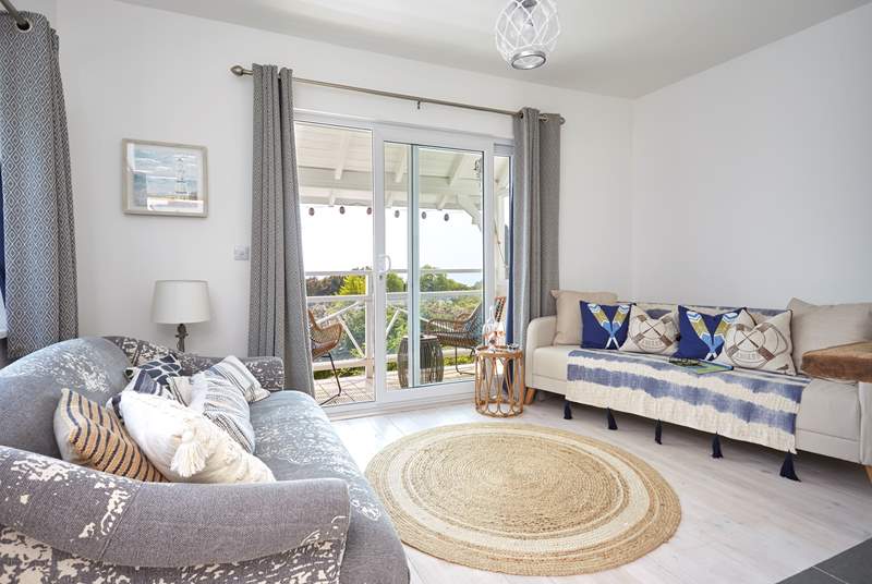 With a fabulous balcony and views towards the ocean, the living space is charming.