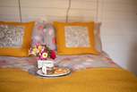 The sumptuous double bed promises a peaceful night's sleep. 