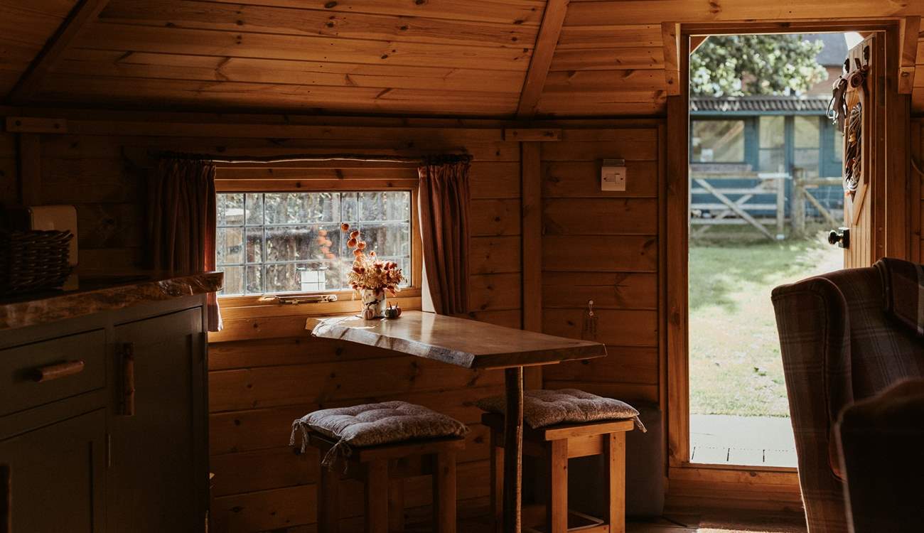 Take a seat at the dining table or...