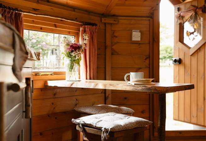Take a seat at the dining table or...