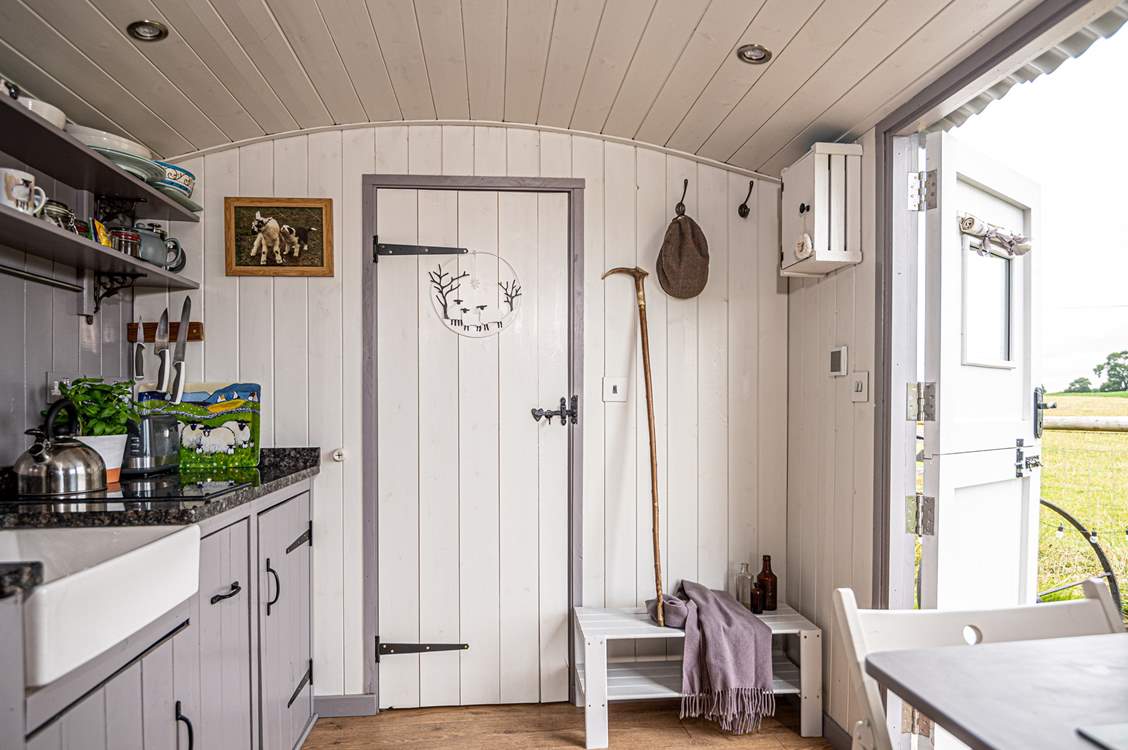 The en suite shower-room is to the right of the hut.