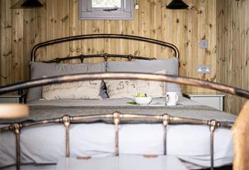 The comfy double bed is the perfect place to savour slow mornings.