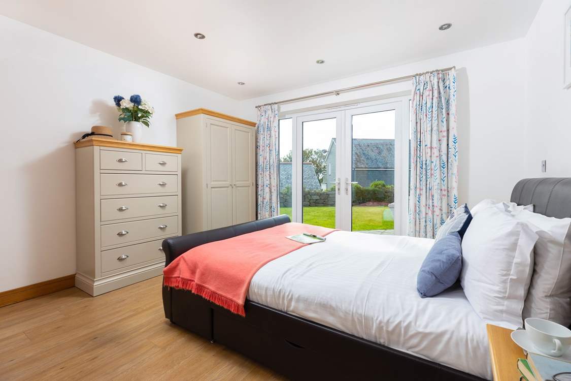 Open the double doors and head out to the sunny garden from bedroom 1.