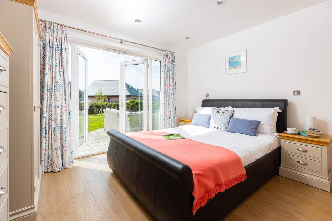 Bedroom 1 is a ground floor king-size room with direct access to the sunny garden.