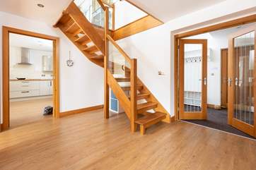 Head upstairs to find two more bedrooms and the sitting-room.