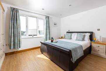 Bedroom 3 is a spacious room with a king-size bed.