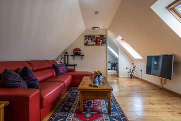 Sloping ceilings and door that leads into the bedroom.
