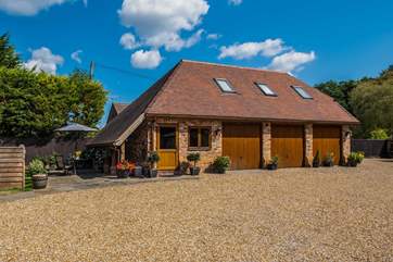 The outside of The Cottage with private parking for two cars.