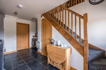 Stairs lead from the kitchen to the living area.