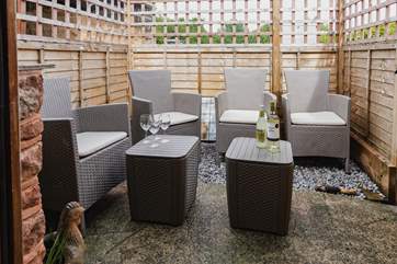 Leading out from the utility-room is this small outdoor seating area which is a lovely spot for an evening drink. There is also a private garden just over the farmyard.