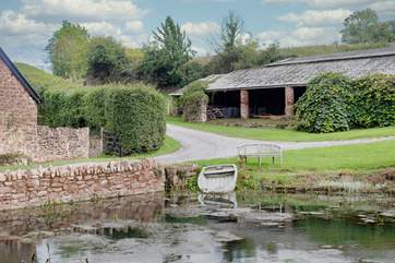 Through the gate on the left is the cottage garden with table and chairs - a lovely spot for an after dinner drink. Please take care around the pond.