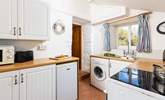 The kitchen leads through to the sitting/dining-room, please watch your head on the steps and low beam in this old cottage.  - Thumbnail Image