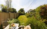 The pretty cottage garden catches the lunch time and  afternoon sun.  - Thumbnail Image