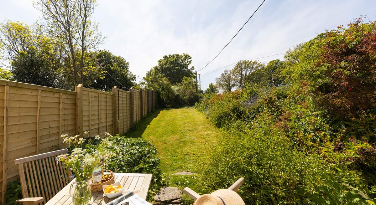 The pretty cottage garden catches the lunch time and  afternoon sun. 