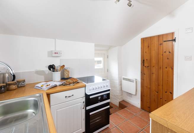 The shower room leads off the kitchen and the stable door leads to the car parking area. 