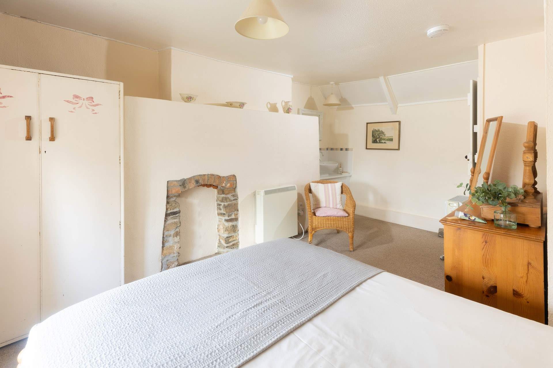 The bedroom has a handy sink in it. 