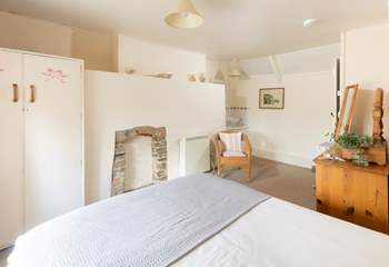 The bedroom has a handy sink in it. 